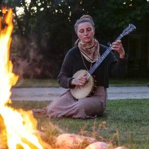 Dayna playing the Banjo